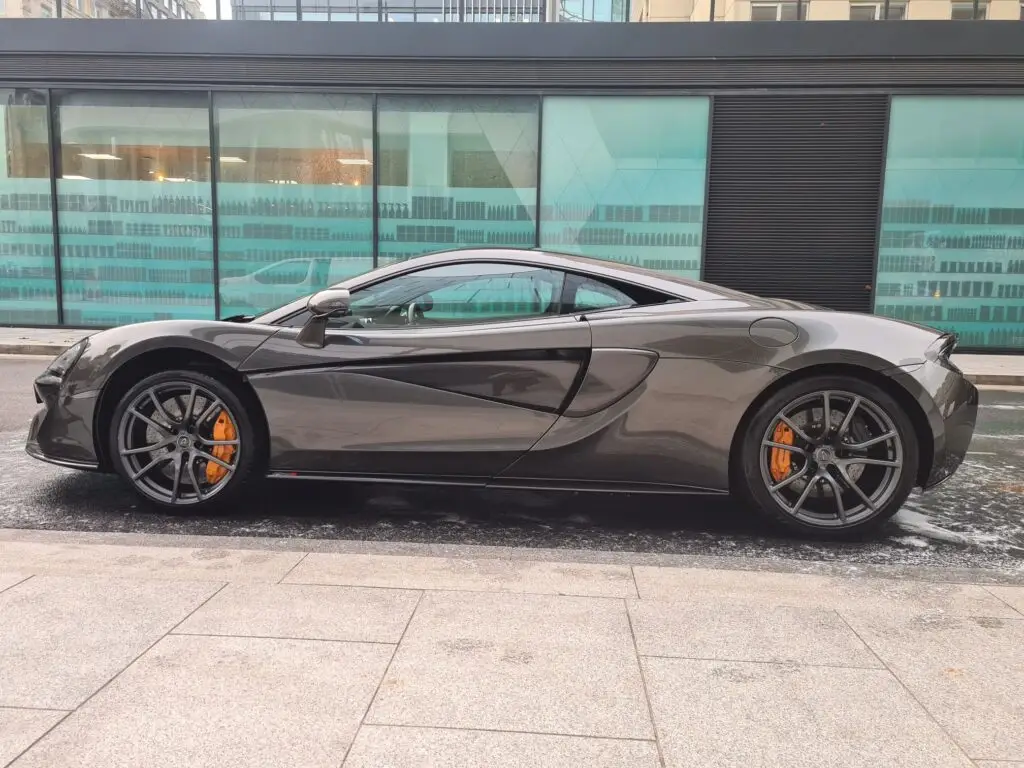 A car being valeted at the kerb