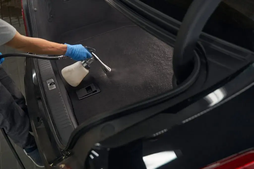 car detailer washing modern vehicle interior with 2024 10 22 10 06 43 utc 1 1