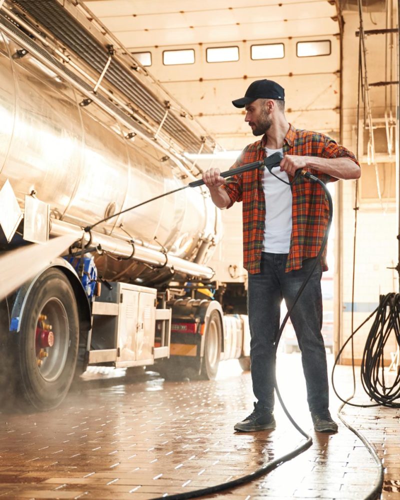 standing-and-washing-the-vehicle-young-truck-driv-2023-11-27-05-31-16-utc (1)